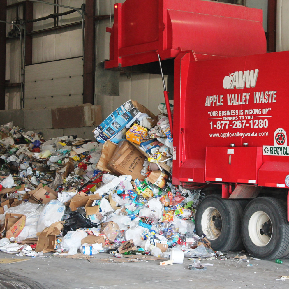 [PHOTO OF TRUCK DUMPING RECYCLABLES]